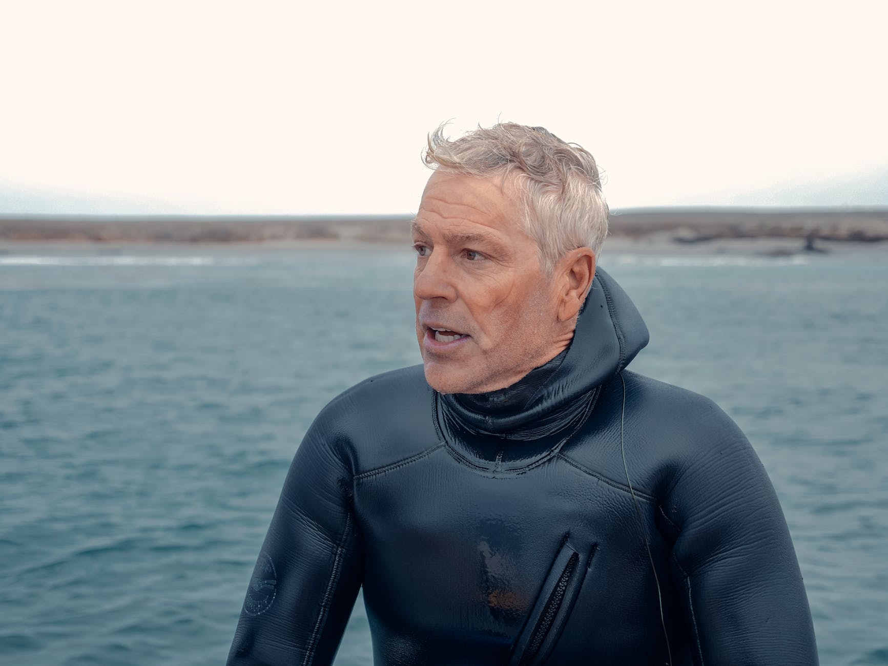 man wearing scuba diver wetsuit